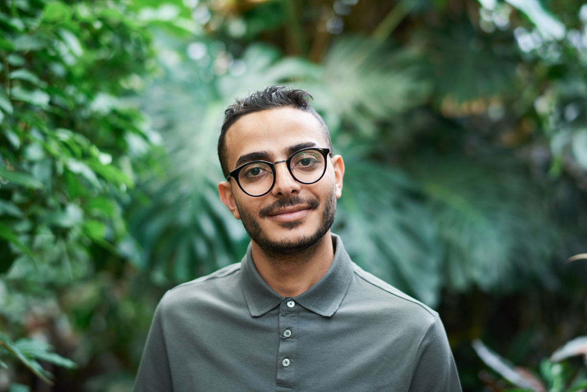 Portrait Photo Of Man Standing Beside Plants